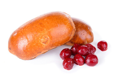 Fresh baked pasties with cherry isolated on white