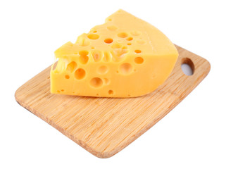Piece of cheese on wooden board, isolated on white