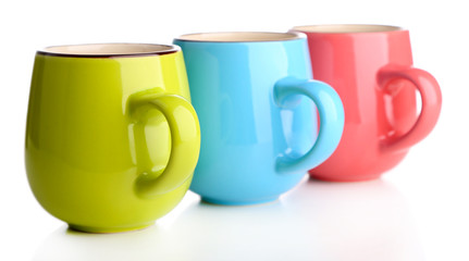 Colorful cups isolated on white