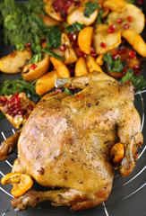 Whole roasted chicken with vegetables and fried potatoes
