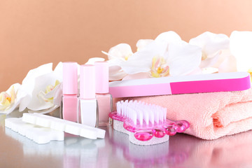Pedicure set on table on beige background