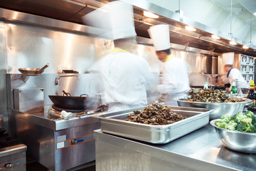 motion chefs of a restaurant kitchen