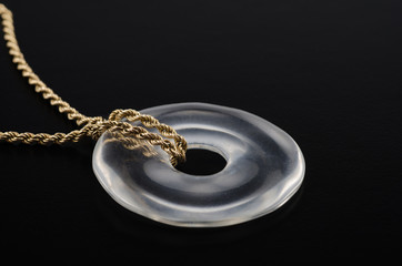 Rock crystal donut on golden chain