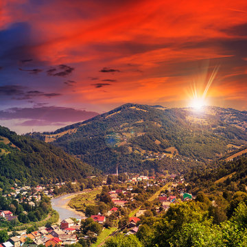 village near the river to forest in mountain at sunset
