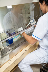 Naklejka premium Technician Experimenting In Laboratory