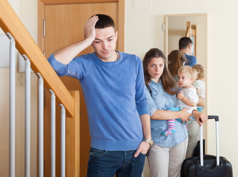 Disappointed woman leaving from home