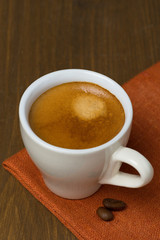 cup of espresso and coffee beans