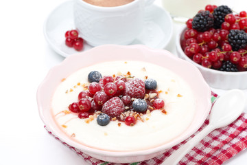 semolina porridge with fresh berries and nuts for breakfast