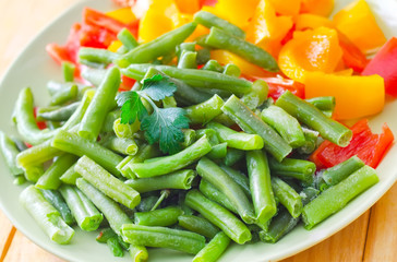 Fresh raw vegetables in the green plate