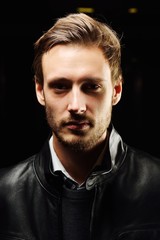 Fototapeta premium Fashionable young man with leather clothes on