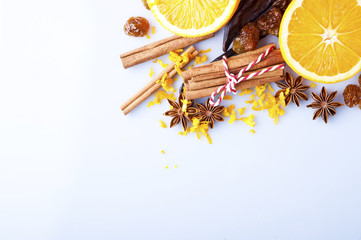 Sliced orange with cinnamon sticks and anise