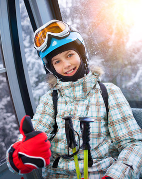 Skier girl on ski lift