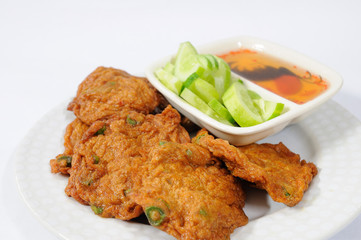 fried fish cakes with cucumber sauce.