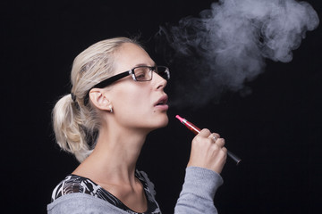 Fototapeta premium Woman Smoking E-Cigarettete