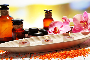 Beautiful spa setting with flower on bright background