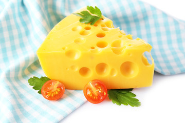 Piece of cheese and tomatoes,on color napkin, isolated on white
