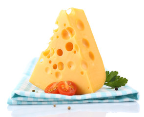 Piece of cheese and tomatoes,on color napkin, isolated on white