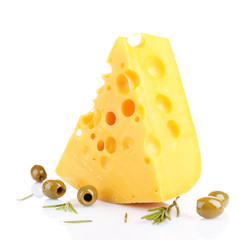 Piece of cheese with green olives, isolated on white