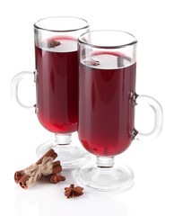 Mulled wine with nuts and spices isolated on white