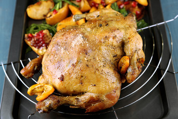 Whole roasted chicken with vegetables and fried potatoes