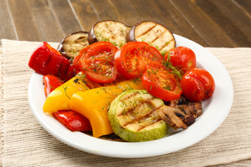 Delicious grilled vegetables on plate on table close-up