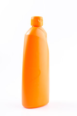 Orange cleaning bottle on isolated white background