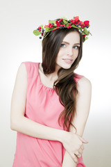 Young beautiful woman with flower wreath on head