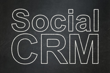 Business concept: Social CRM on chalkboard background