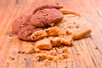 Stack of Chocolate chip cookies on wooden background.