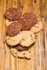 Stack of Chocolate chip cookies on wooden background.