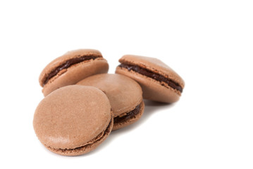 Four homemade chocolate Macaron isolated in white background