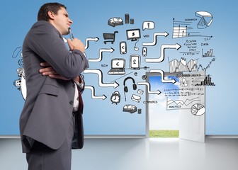 Composite image of thinking businessman holding his glasses