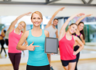 Fototapeta premium sporty woman with tablet pc blank screen