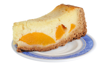 A piece of fruit cake on the saucer isolated on white