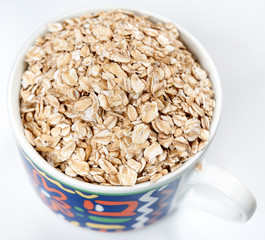 Oatmeal with raisins isolated on a light background