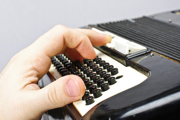 Hand on accordion close up