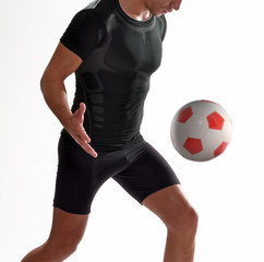 Soccer playing with soccer ball on white background.