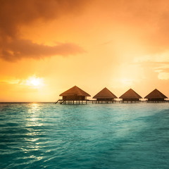 Over water bungalows with steps into amazing green lagoon