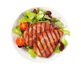 Grilled pork with salad greens