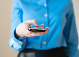 Close up of a woman using mobile smart phone