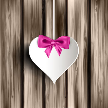Abstract heart on wooden background