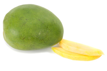 Fresh juicy Mango fruit and two slices isolated on white backgro