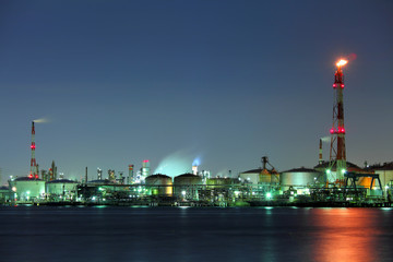 Fototapeta na wymiar Industrial building and seascape at night