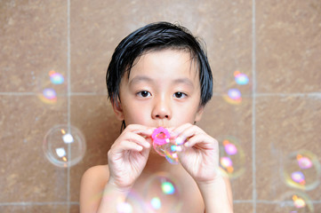 Young boy having fun with bubbles