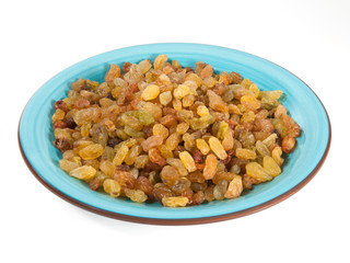 Raisins in a bowl isolated on white background
