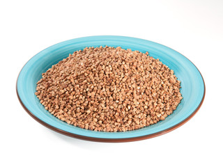 Buckwheat in bowl isolated on white background