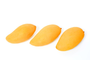 Three ripe golden mangoes