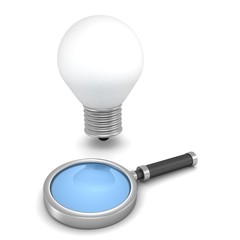Magnifying glass and concept idea light bulb on white background