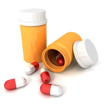 Orange Pill Bottle With Cover Spilling Red Medical Pills