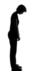 one young teenager   girl sad looking down silhouette
